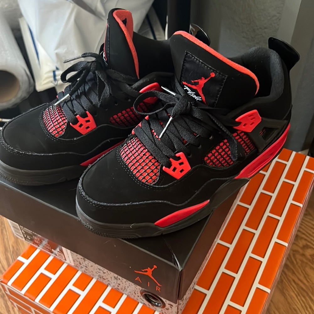 Red thunder Jordan 4 size 6y boys Grade school.